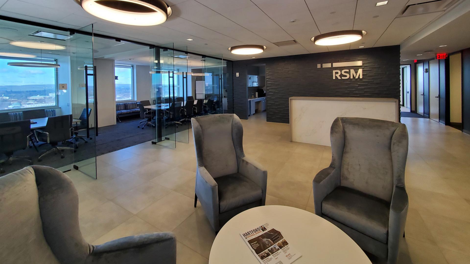 Spacious reception area with access to conference room, private phone booths and amenity spaces